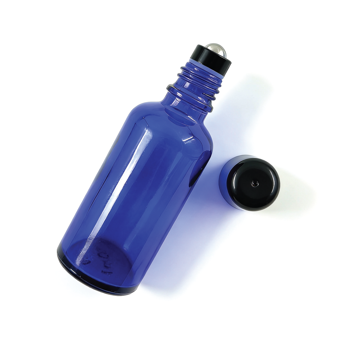 Black 18 mm roller ball with cap on blue glass bottle ideal for perfumes, essential oils and liquid skincare applications