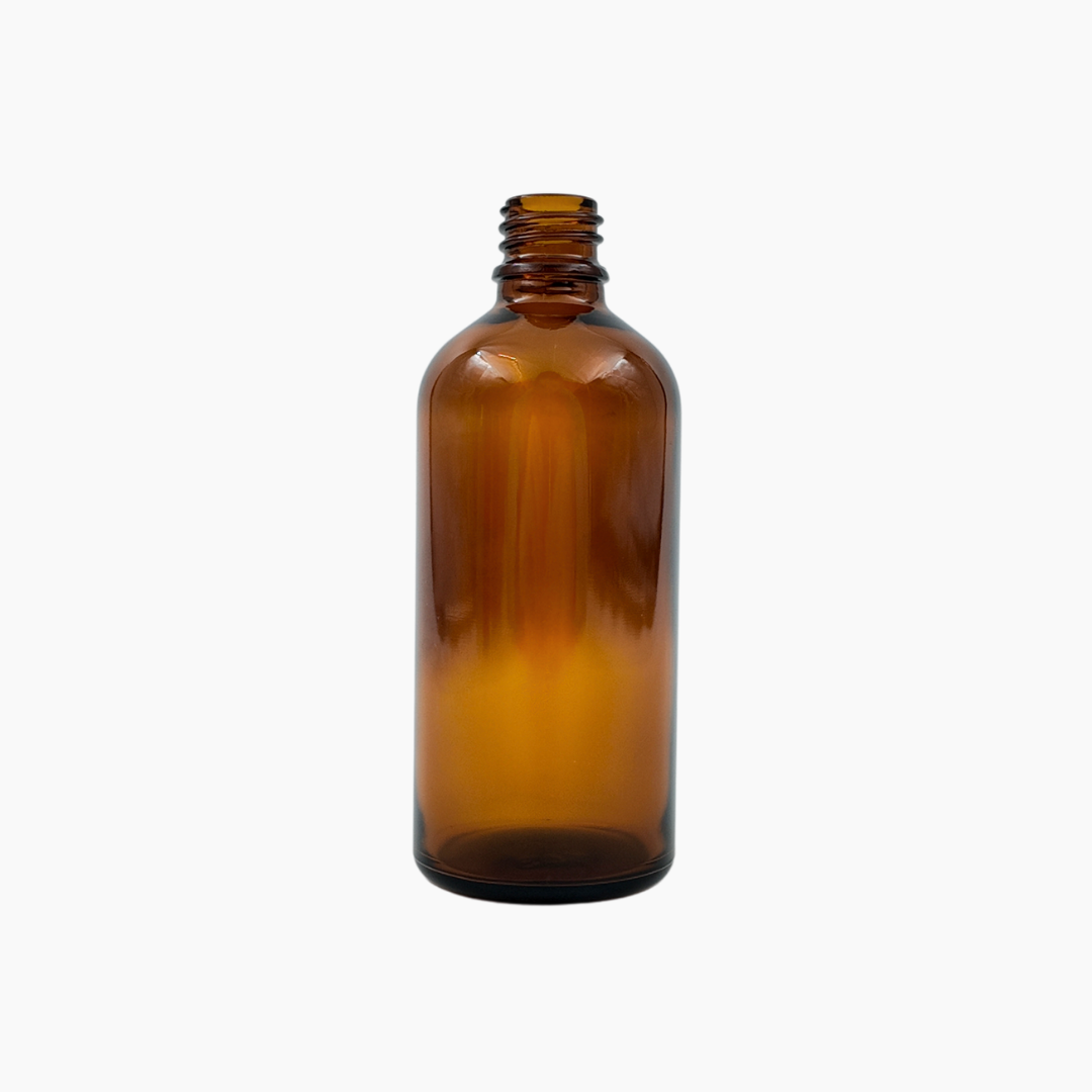 Amber 100ml glass bottle standing upright on white background