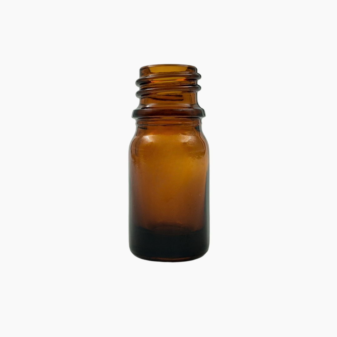 Amber glass bottle on a white background