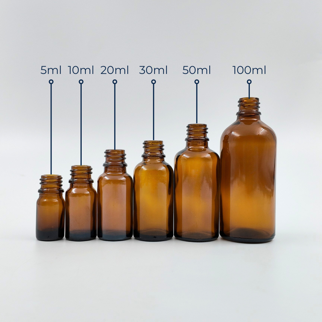 Set of amber glass bottles in different sizes displayed together