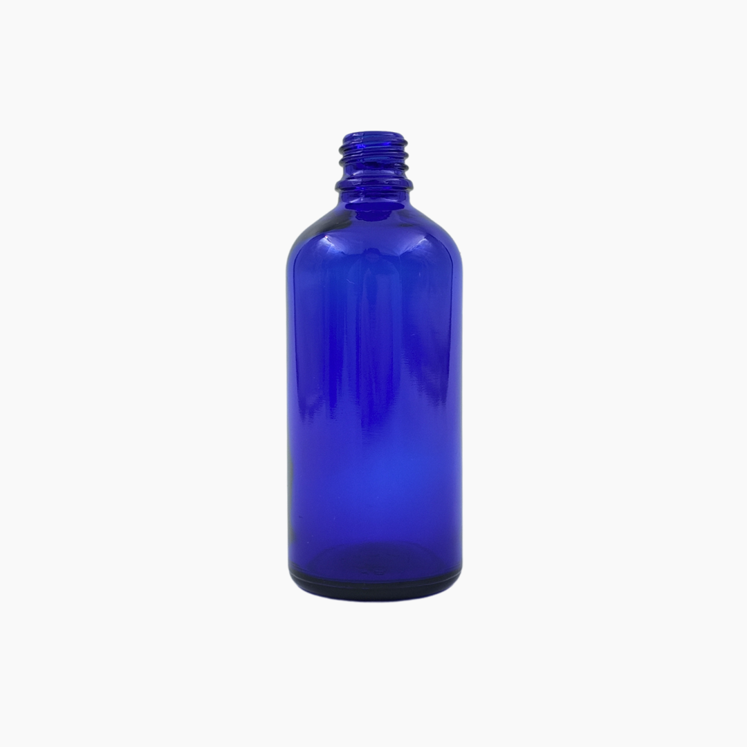 Blue 100ml glass bottle standing upright on white background