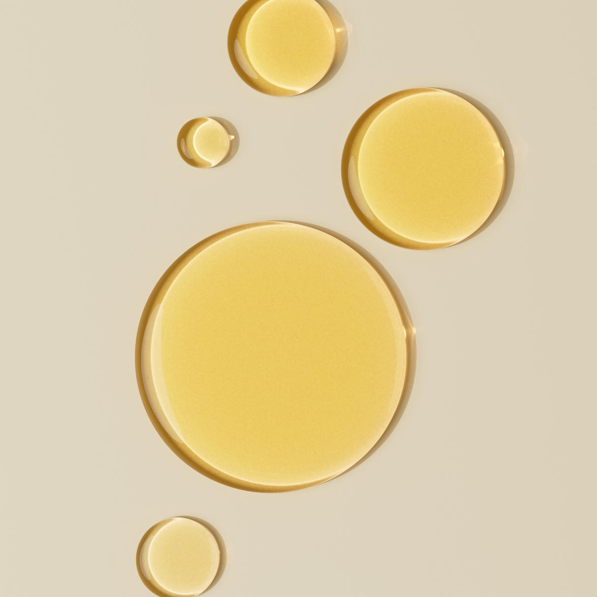 A close-up of Brightpack Tissue Oil, showcasing its smooth, lightweight texture that penetrates deeply into the skin, offering intense hydration, reducing scars, and improving skin elasticity.Close-up of Brightpack Tissue Oil #21 yellow drops highlighting liquid texture and colour