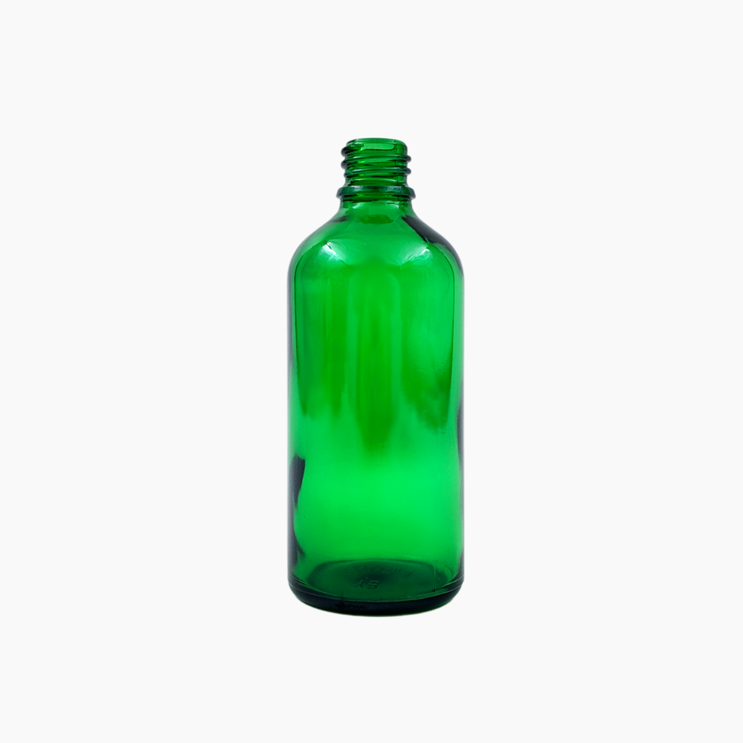 Green 100ml glass bottle standing upright on white background