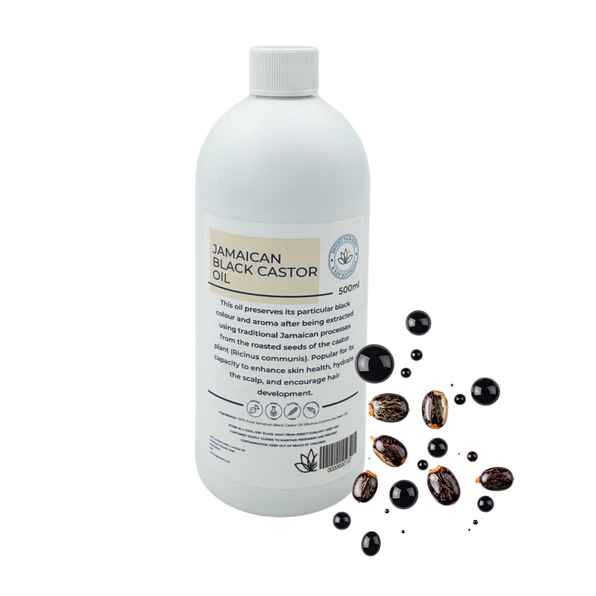500ml Bottle of Jamaican Black Castor Oil with oil droplets and seeds on a white background