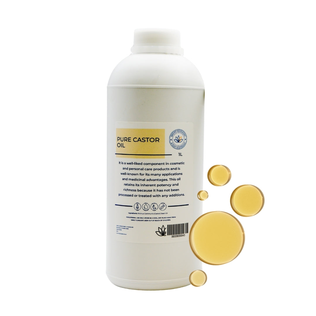 1L bottle of pure cold-pressed castor oil with golden oil drops, hexane-free and natural.