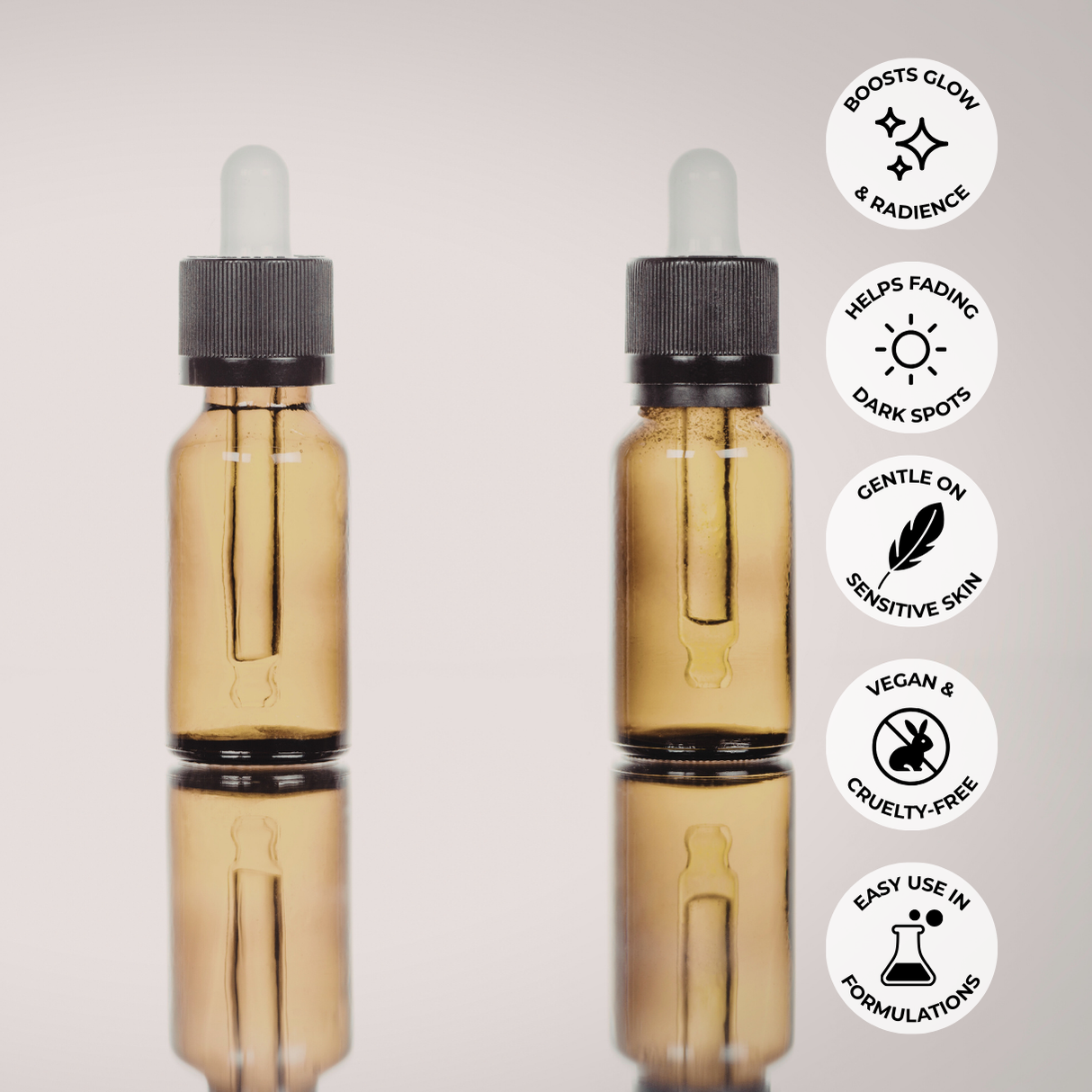 Two amber glass dropper bottles with vitamin c oil, featuring icons and text about product benefits.