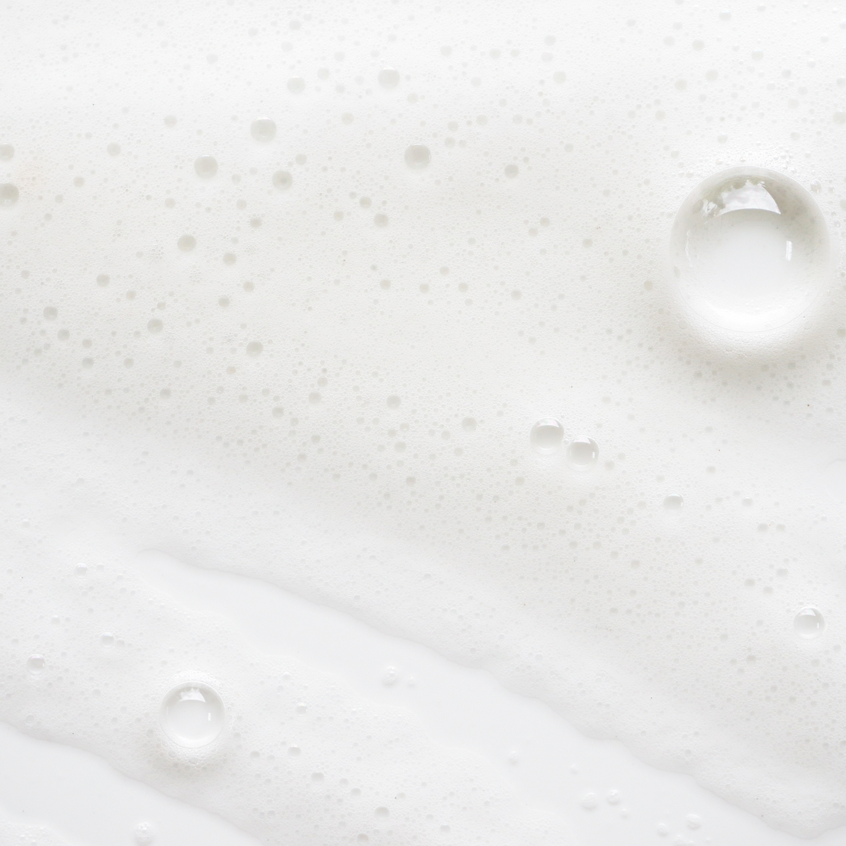 A detailed close-up showcasing the smooth, clear handwash formula with a gentle lather.Close-up of Brightpack Handwash #38 showing silky soapy liquid texture with bubbles