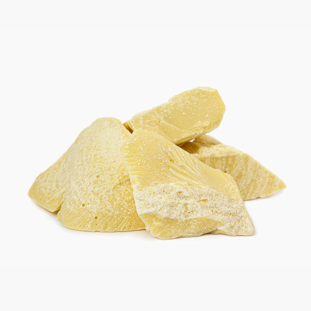 Four Blocks Of Solid Cocoa Butter On White Background | Bulk Cosmetic Butters | Brightpack Raw Materials