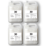 Pack of four 5 L jerry cans of Brightpack 2-in-1 shampoo combining cleansing and conditioning.