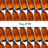 Collection of amber 500ml glass bottles, empty cosmetic packaging for serums, oils and skincare formulations