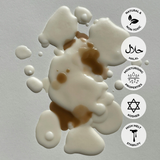 White and brown wax drops on a gray background with product feature icons.