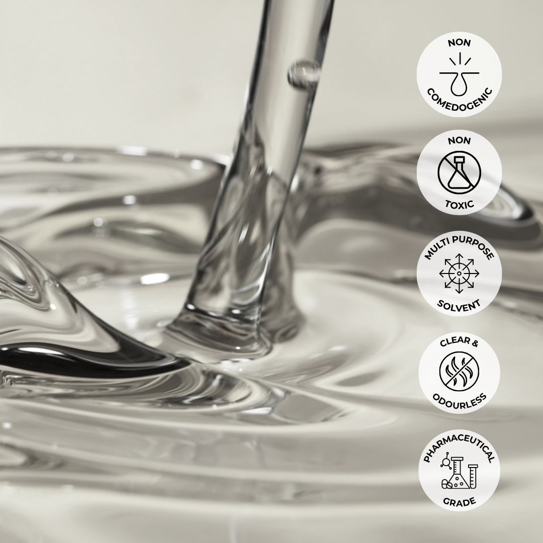 Mineral oil being poured with icons indicating non-comedogenic, non-toxic, multi-purpose, clear & odourless, and pharmaceutical grade properties.