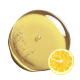 Vitamin C-OS (oil-soluble) and a slice of lemon on a white background.
