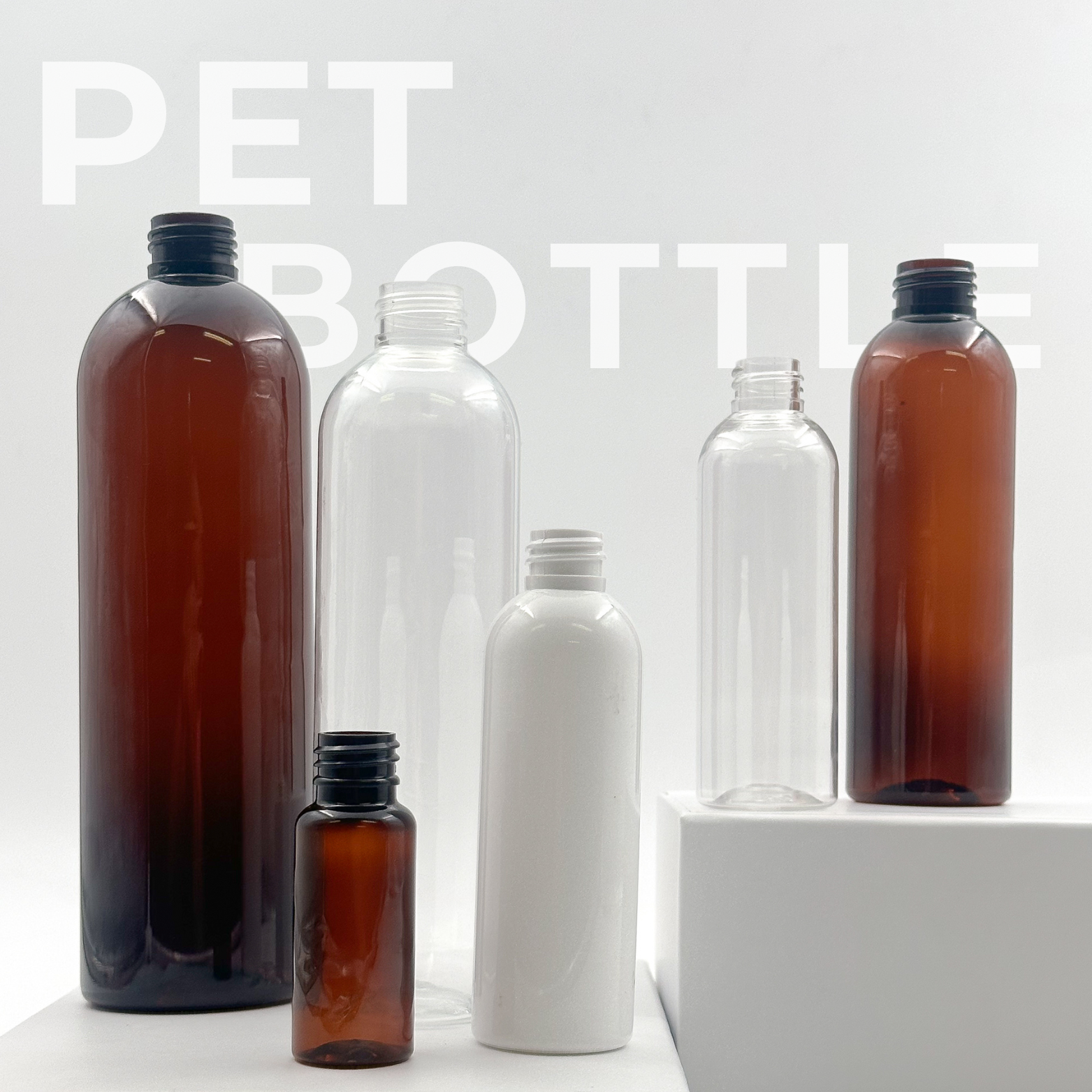 PET Bottles without closures, in colours amber, clear, solid white.