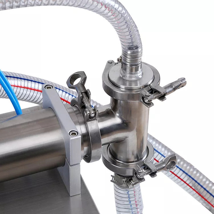 Pneumatic liquid filler closeup of controls and nozzle